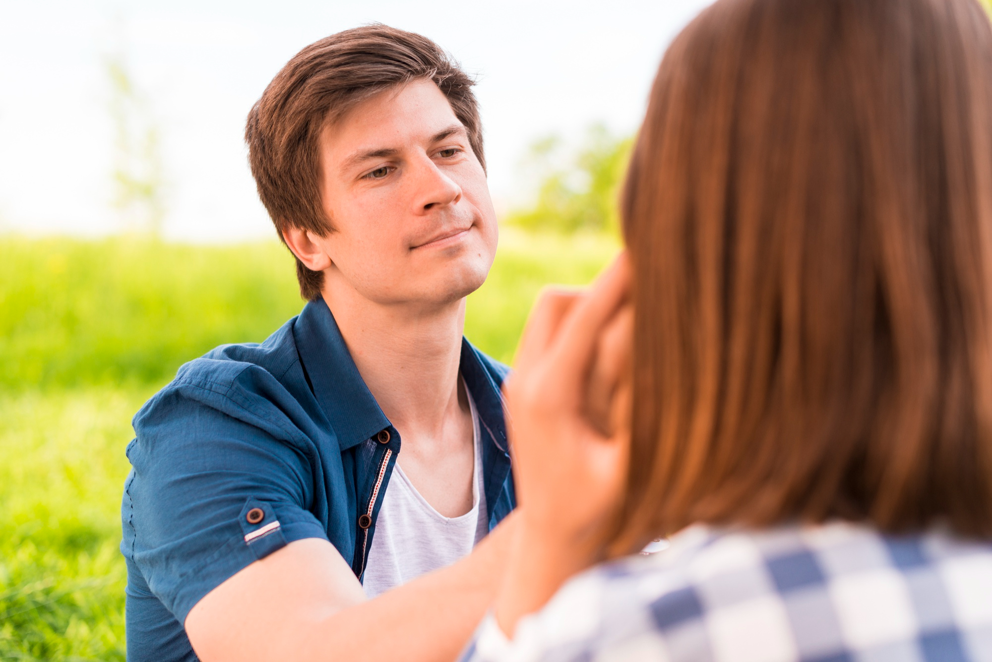 A man being sincere while touching his partner's cheek | Source: Freepik