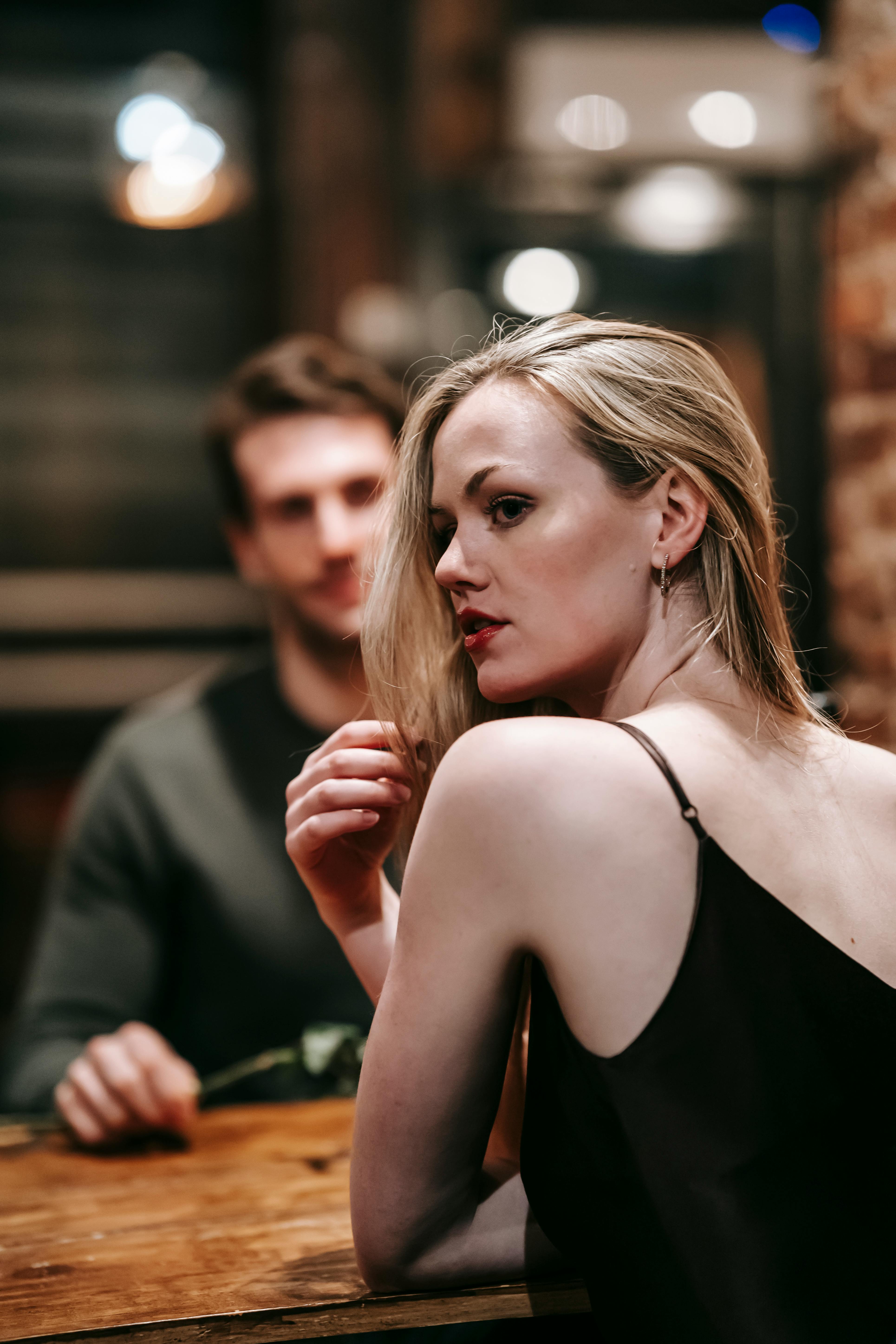 A woman looking confused while at dinner | Source: Pexels